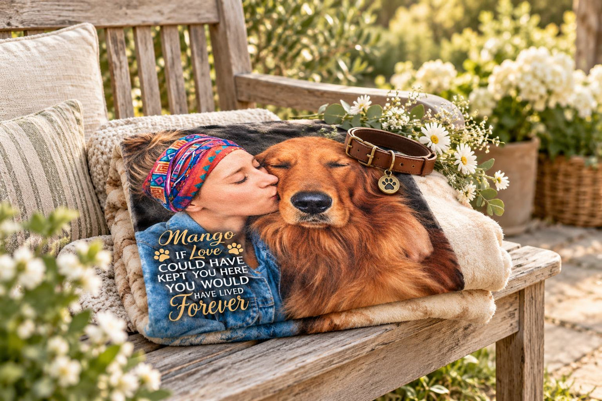 Personalized dog memorial blanket folded on a garden bench with the dog's collar and flowers
