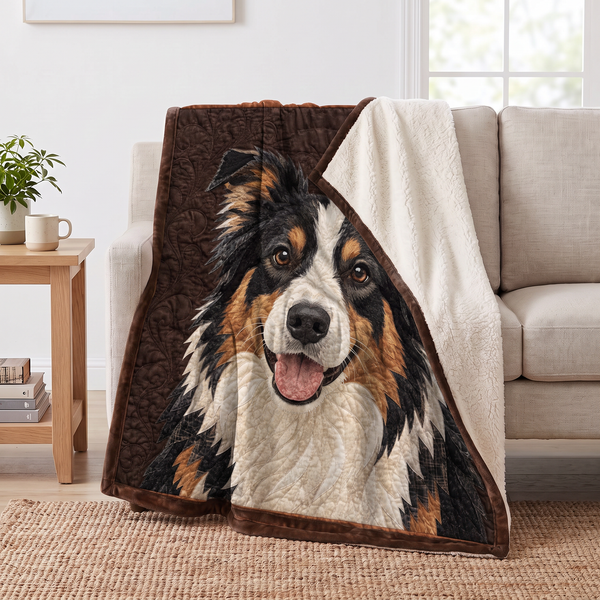 Stitched Border Collie Portrait sherpa blanket draped over a sofa, corner folded back to show the cream sherpa reverse