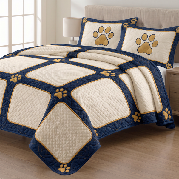 Navy Dog Paw Photo Frame quilt set with two matching pillow shams on a made bed