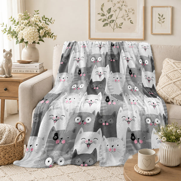 Grey Kawaii Cat Fleece Throw Blanket on a made bed