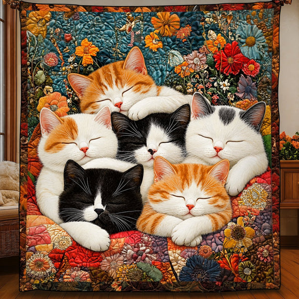 Kitten Nap Pile quilt – quilt showing a pile of sleeping ginger, black and white kittens on a floral patchwork