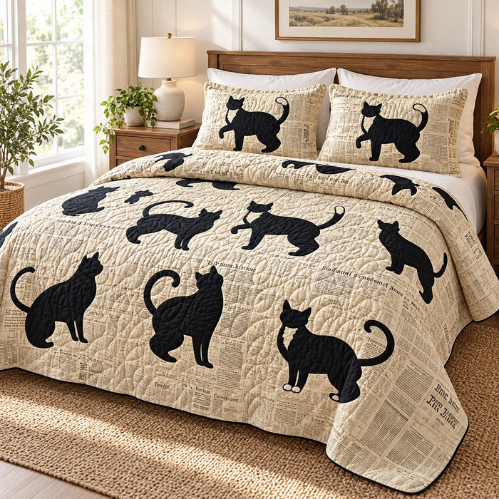 Newsprint Black Cats quilt set – quilt and two matching shams on a queen bed in a bright neutral bedroom