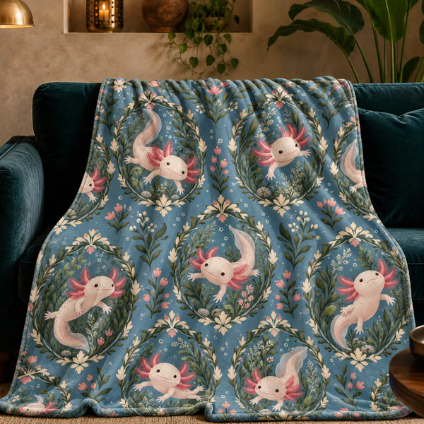 Botanical Medallions Axolotl fleece throw blanket — blush axolotls inside green leaf medallions with pink buds on dusty slate blue