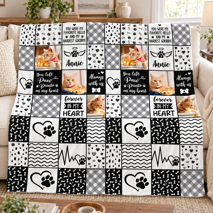 Black and white patchwork pet memorial blanket with four photos, on a sofa
