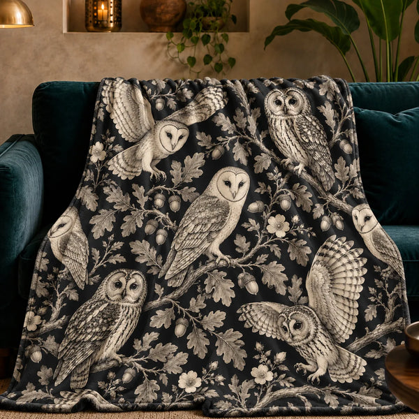 Charcoal Engraving Owl fleece throw blanket — cream engraved barn and tawny owls with oak leaves, acorns and wild roses on black