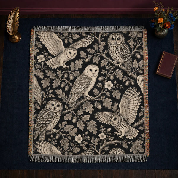 Charcoal Engraving Owl woven throw blanket — cream engraved barn and tawny owls with oak leaves, acorns and wild roses on black