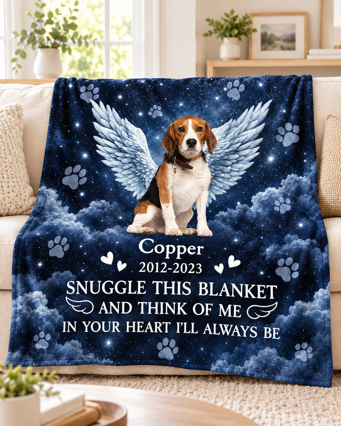 Starry night angel wings pet memorial blanket with photo, name and years, on a sofa