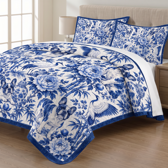 Chinoiserie French Bulldog quilt set with two matching pillow shams on a made bed