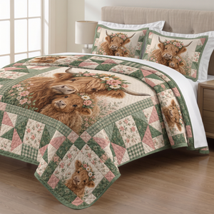 Floral Patchwork Highland Cow quilt set with two matching pillow shams on a made bed