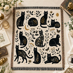 Gilded Silhouette Cat Woven Throw Blanket on a made bed