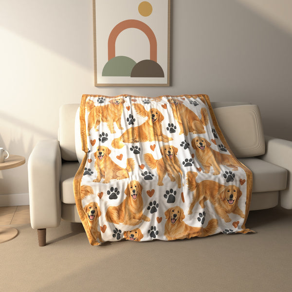 Golden Retriever Paw Print fleece throw blanket draped over a sofa