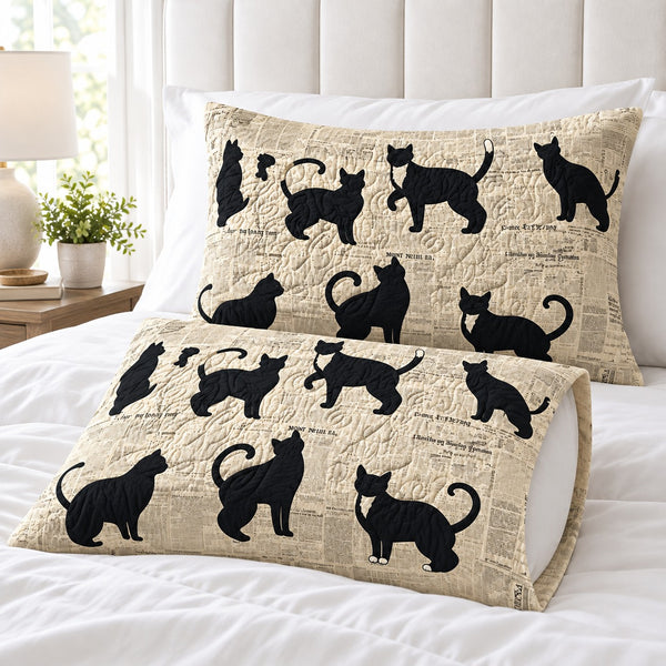 Newsprint Black Cats pillowcases – set of two printed envelope pillowcases on a white bed