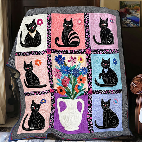 Pastel Vase Black Cats quilt – pastel block quilt with black cats around a central vase of flowers