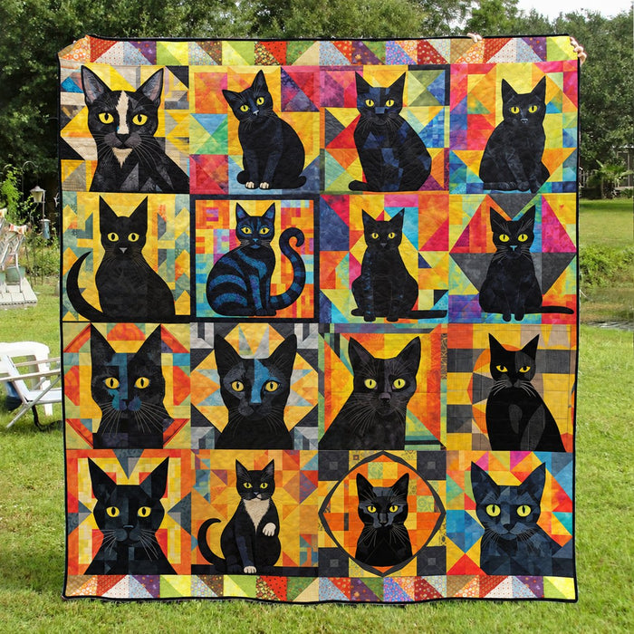 Patchwork Portrait Black Cats quilt – bright patchwork quilt with many yellow-eyed black cats in colourful squares