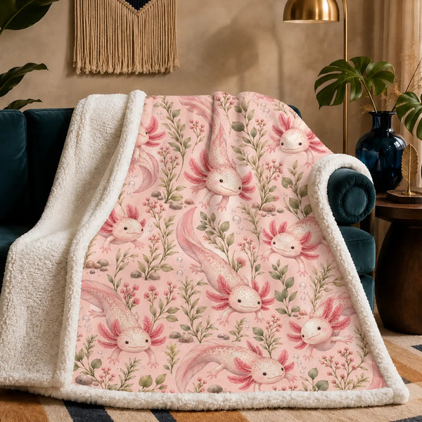 Blush Meadow Axolotl sherpa blanket — pink axolotls with sage stems, pink berry sprigs and pebbles on blush pink