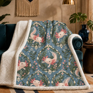 Botanical Medallions Axolotl sherpa blanket — blush axolotls inside green leaf medallions with pink buds on dusty slate blue