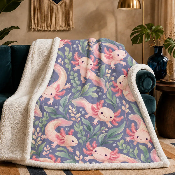Periwinkle Pond Axolotl sherpa blanket — smiling pink axolotls among sage leaves, blush sprigs and bubbles on dusty periwinkle