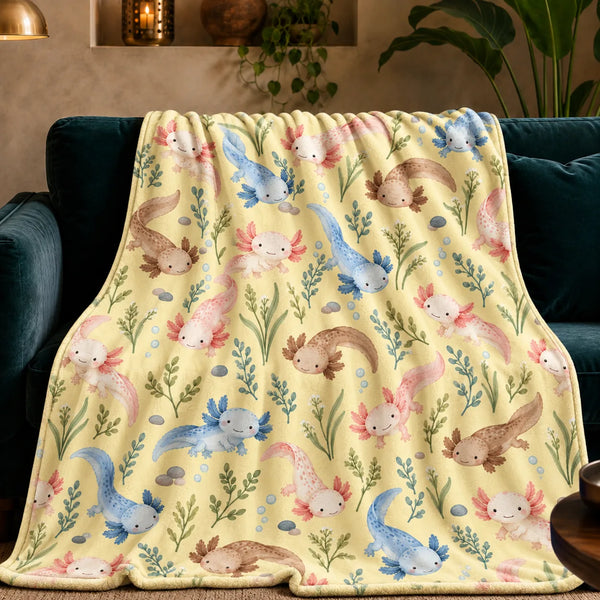 Tiny Ditsy Axolotl fleece throw blanket — small pink, blue and brown axolotls with green sprigs and pebbles on butter yellow