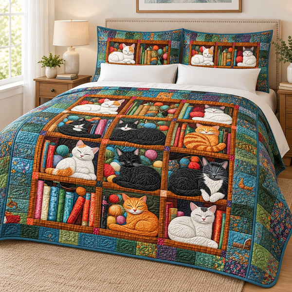 Bookshelf Nap Cats quilt set – quilt and two matching shams on a queen bed in a bright neutral bedroom