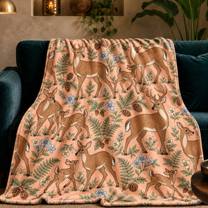 Whimsical Contour Deer fleece throw blanket — outlined cartoon deer and fawns among sage ferns, pinecones and pale blue flowers on apricot