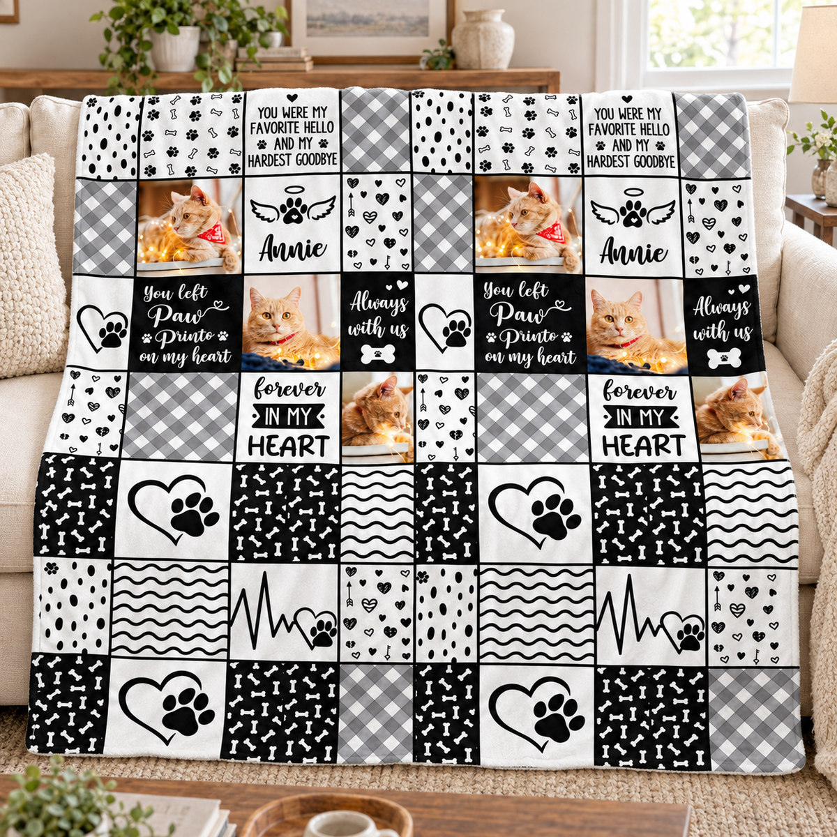 Black and white patchwork pet memorial blanket with four photos, on a sofa