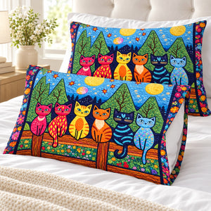 Garden Fence Cats pillowcases – set of two printed pillowcases on a white bed