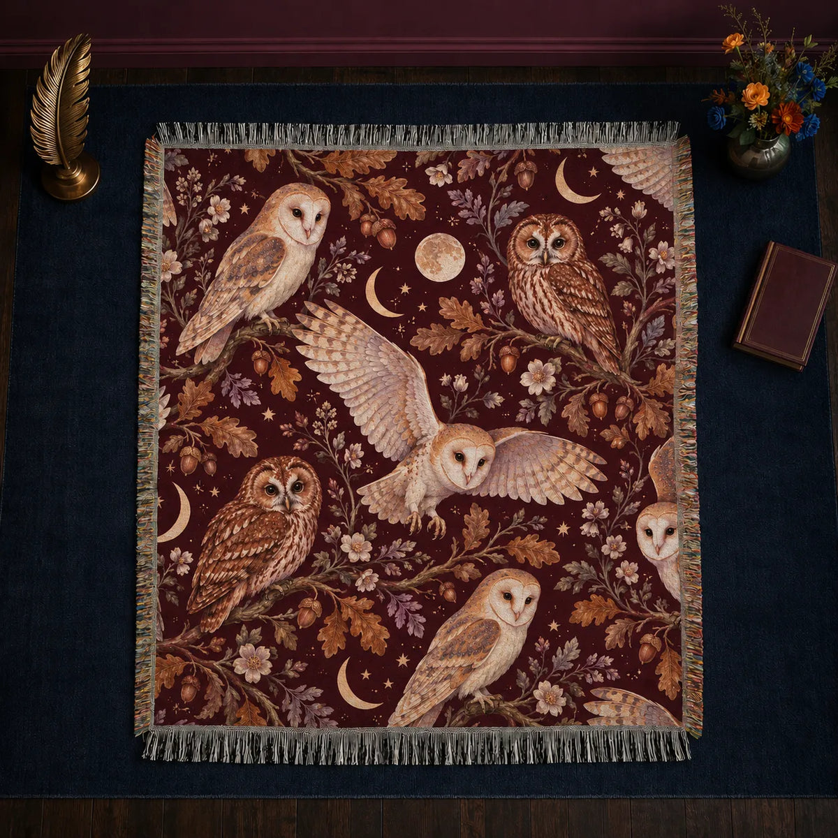 Burgundy Night Owl woven throw blanket — barn and tawny owls with copper oak leaves, moons and gold stars on deep burgundy