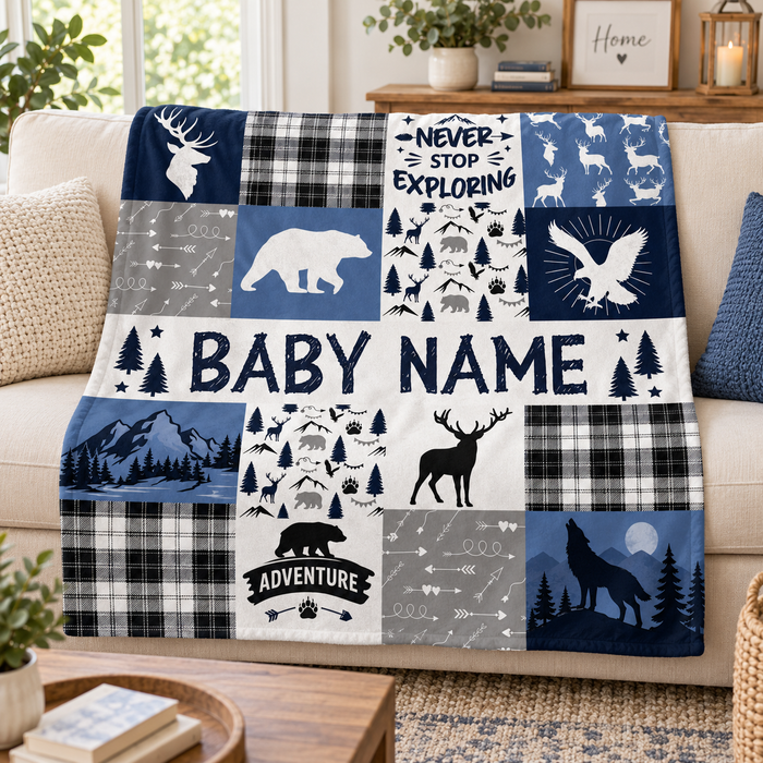 Woodland adventure personalised name blanket in navy plaid, on a sofa
