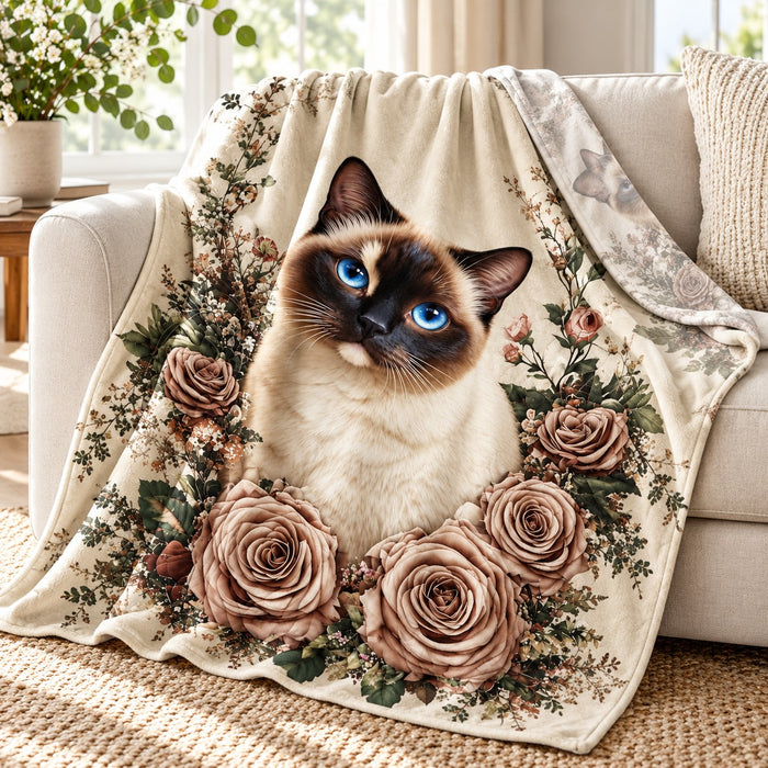 Siamese Rose Garden throw blanket – lightweight printed flannel fleece draped over a cream sofa
